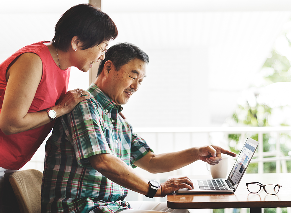 Couple comparing insurance policies online